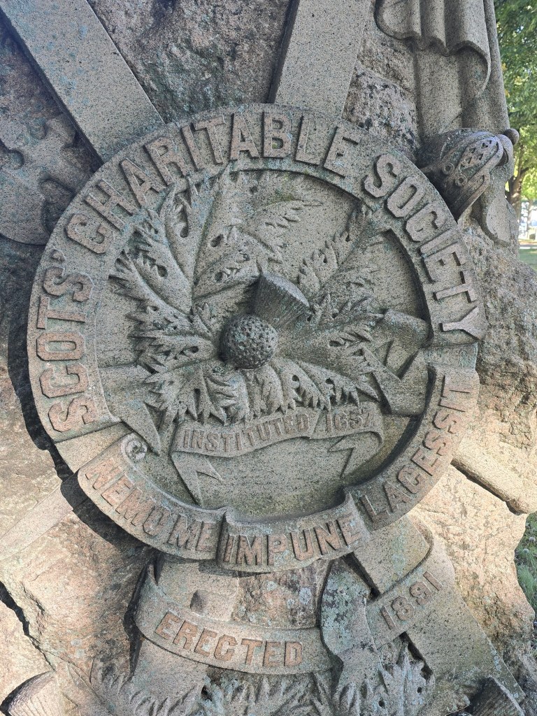 Close-up of the Society's seal with the motto Nemo Me Impune Lacessit